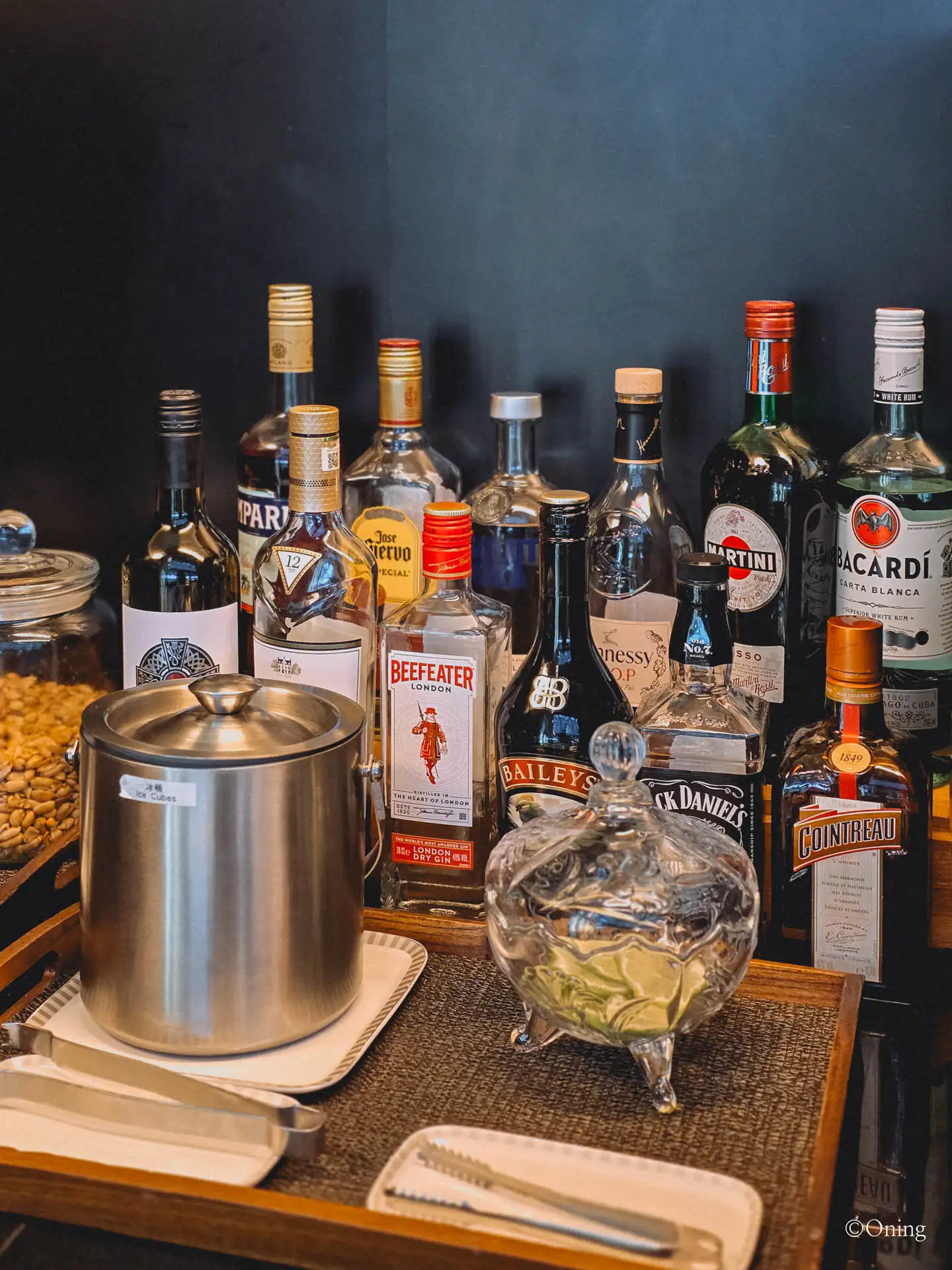Self-serve spirits and liquor selection with an ice bucket at the Taoyuan SilverKris Lounge