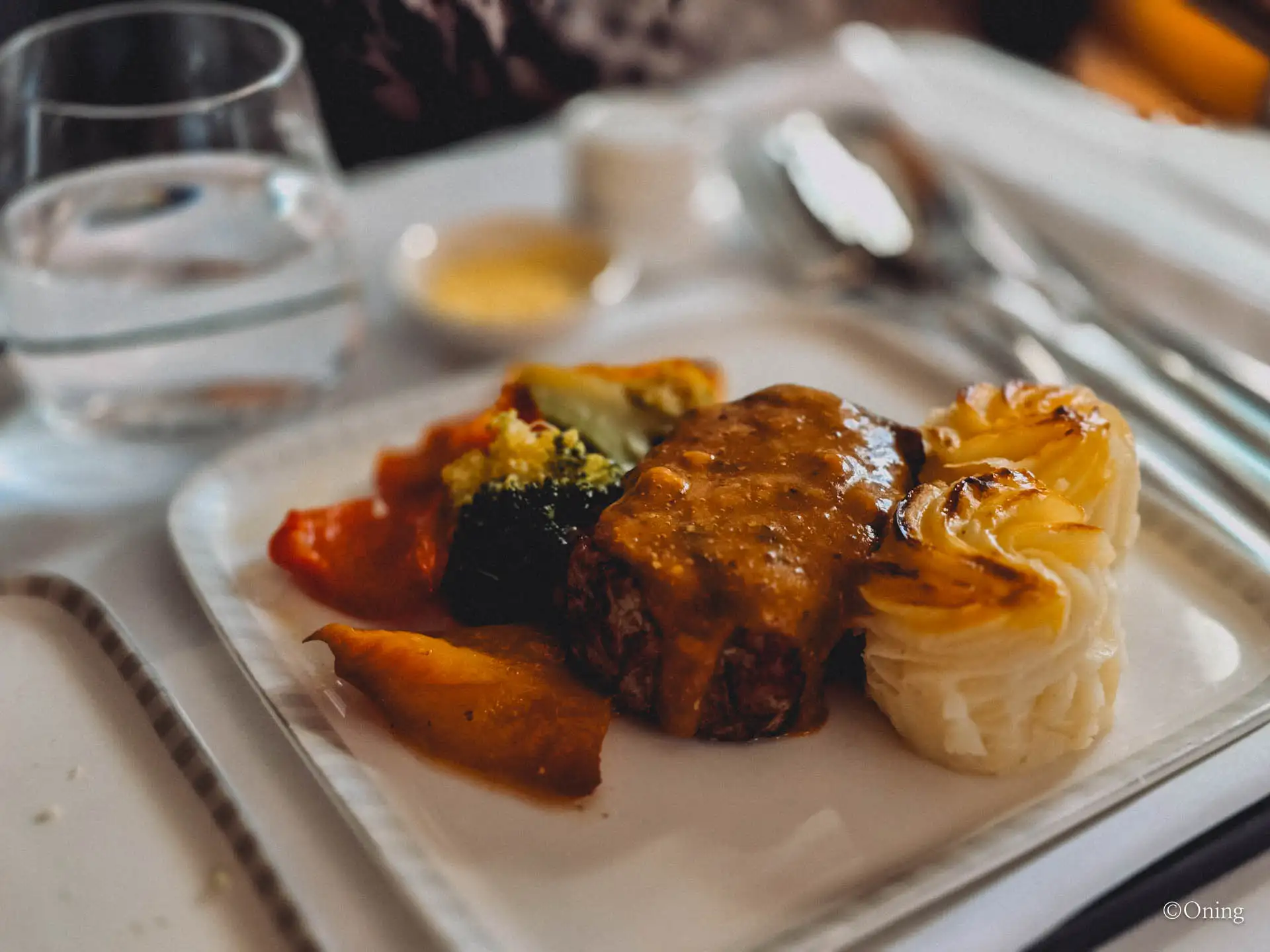 Seared beef fillet main course with brandy mustard sauce, vegetables and potato