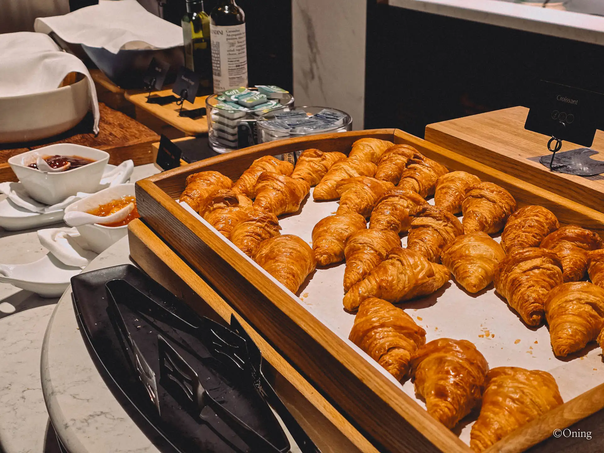 A tray of fresh croissants with jams at the Changi Terminal 3 SilverKris Lounge