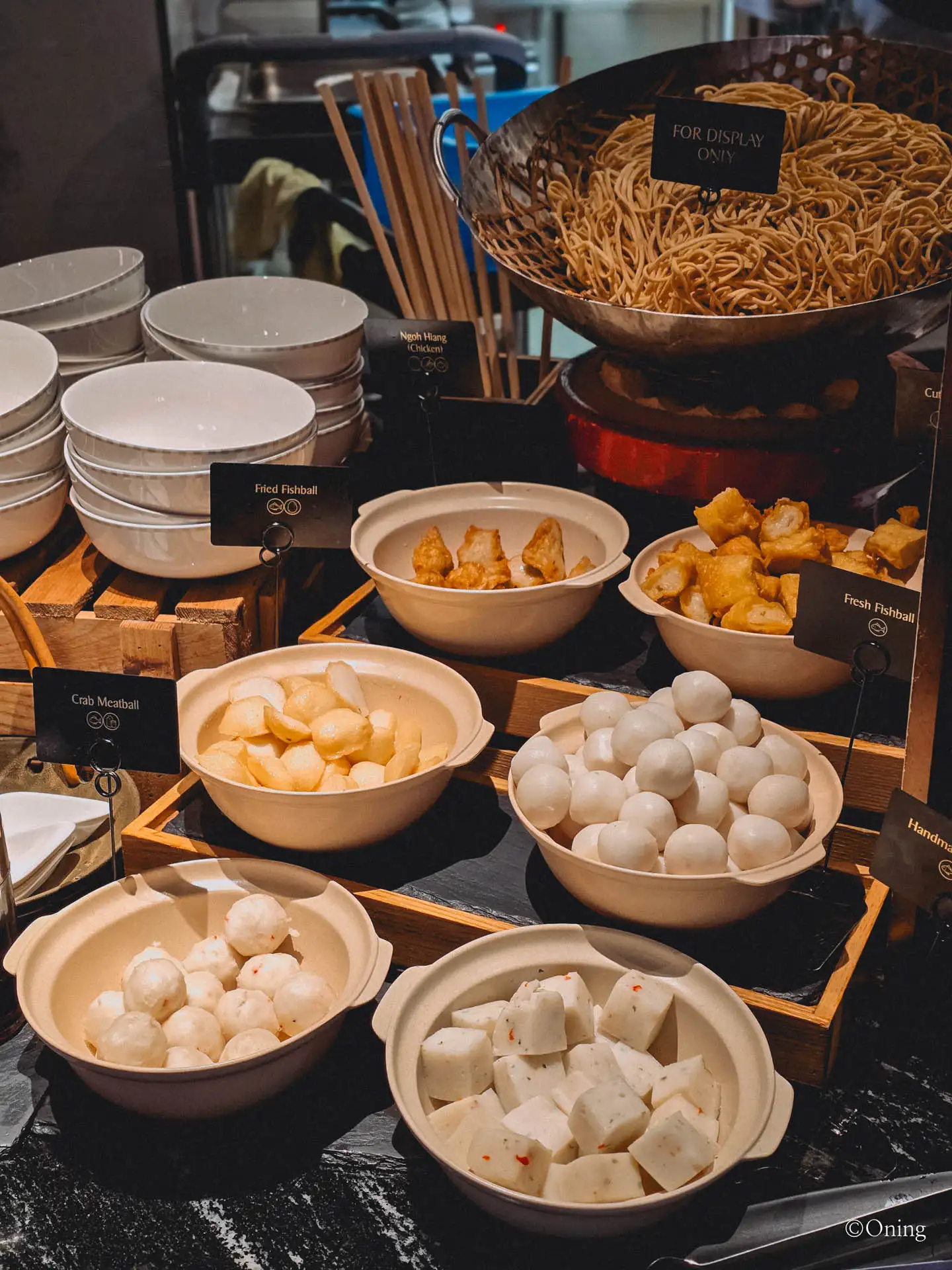 A fishball and meatball station with assorted bowls at the SilverKris Lounge