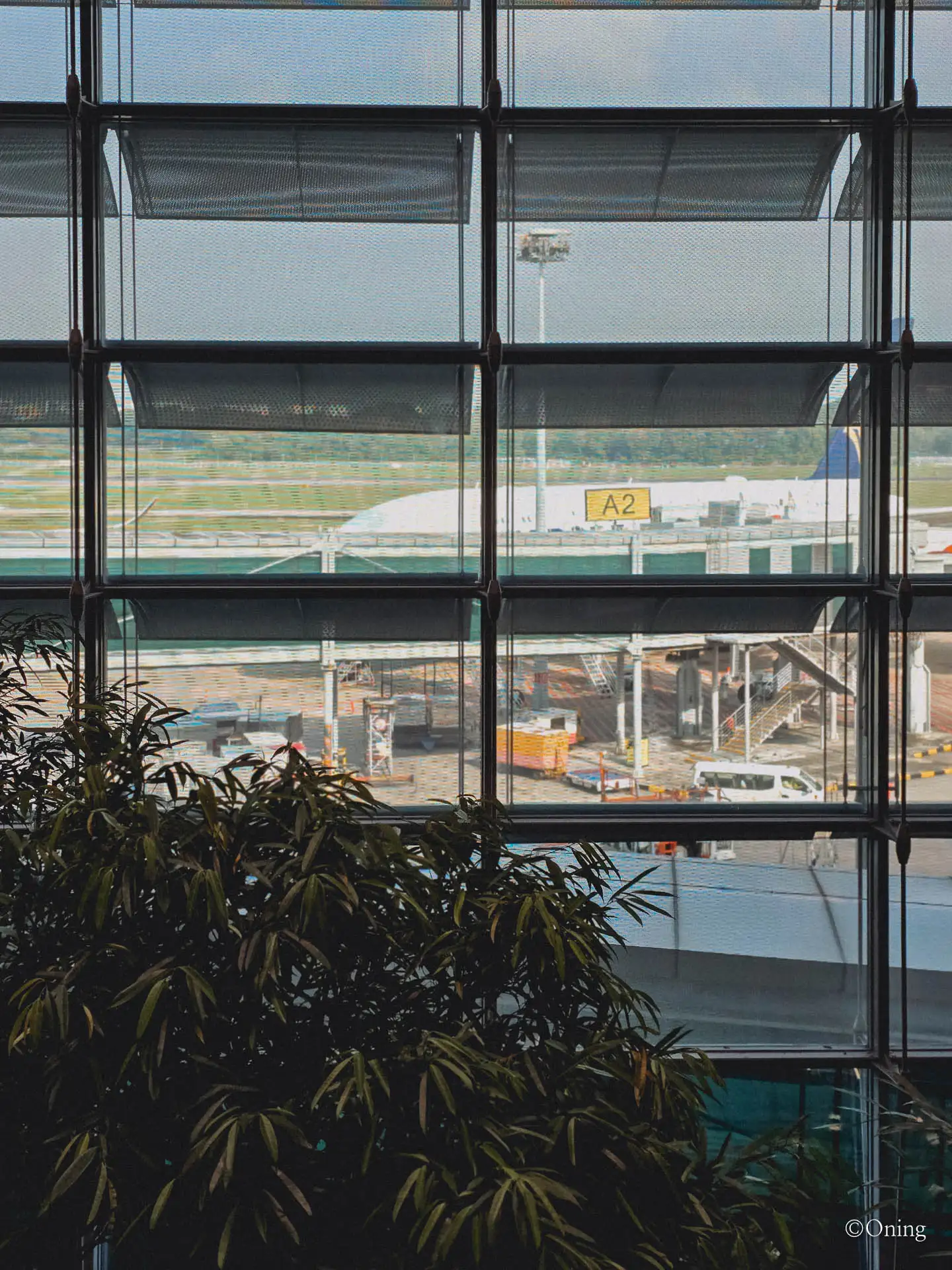 Window view of the tarmac and gate A2 from the Changi Terminal 3 SilverKris Lounge